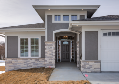 custom gray house with balcony