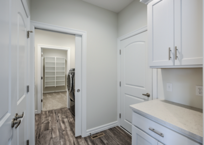 kitchen and laundry area, white kitchen cabinets