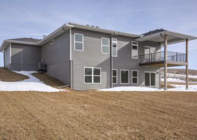 custom gray house with balcony